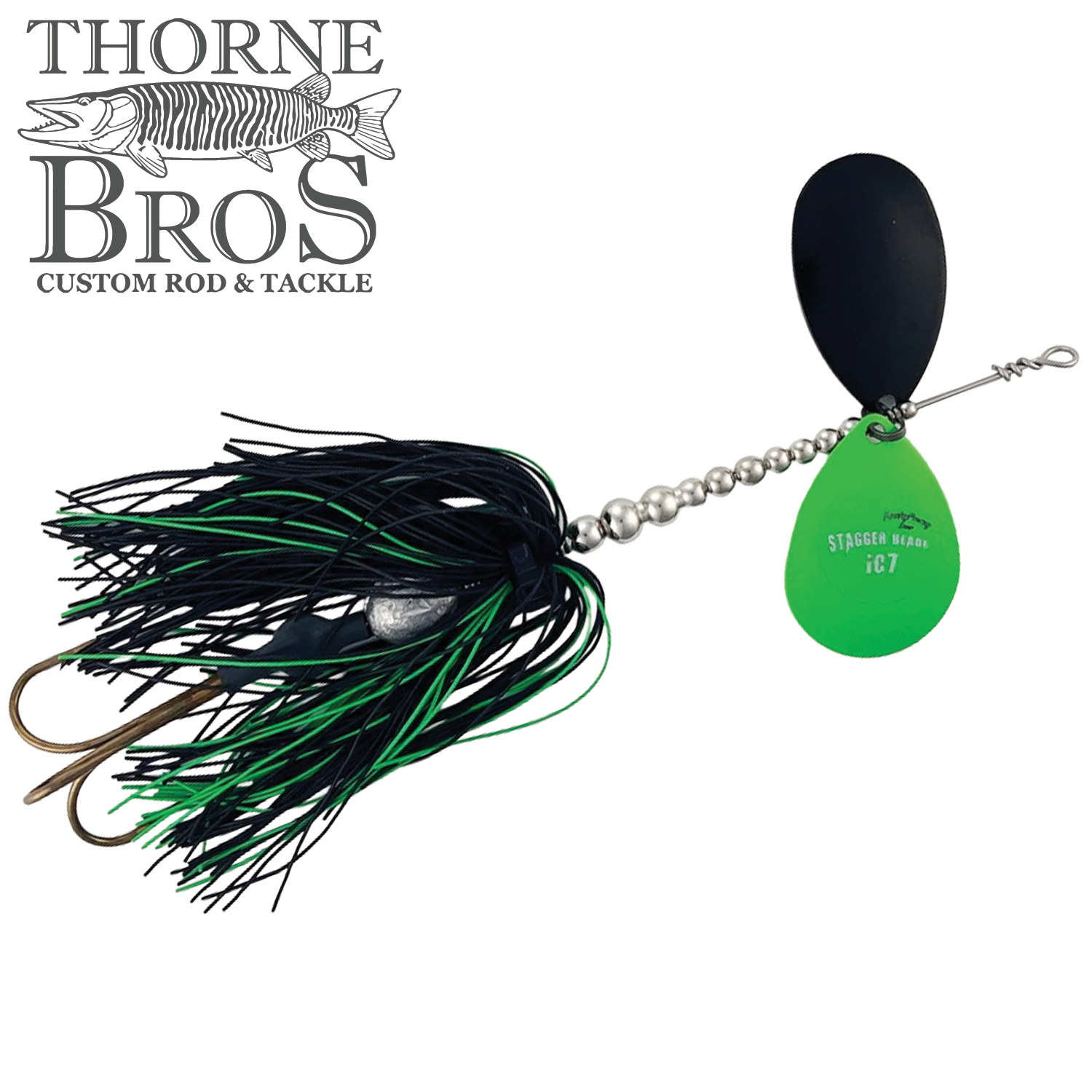 Musky Frenzy Apache Stag IC7 fishing lure featuring black and green skirt, silver spinner blades, and dual bronze hooks designed for musky fishing tackle.