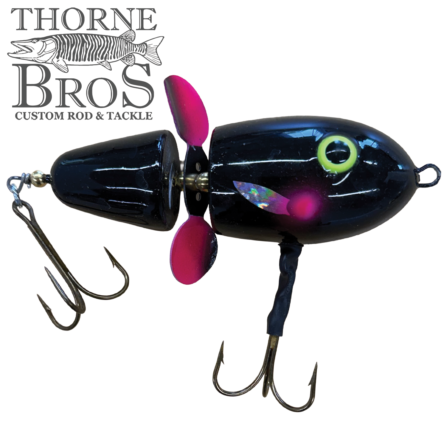 Lake-X Hammer fishing lure in black with a segmented body, bright yellow eye detail, pink propeller, and two treble hooks designed for effective musky fishing.