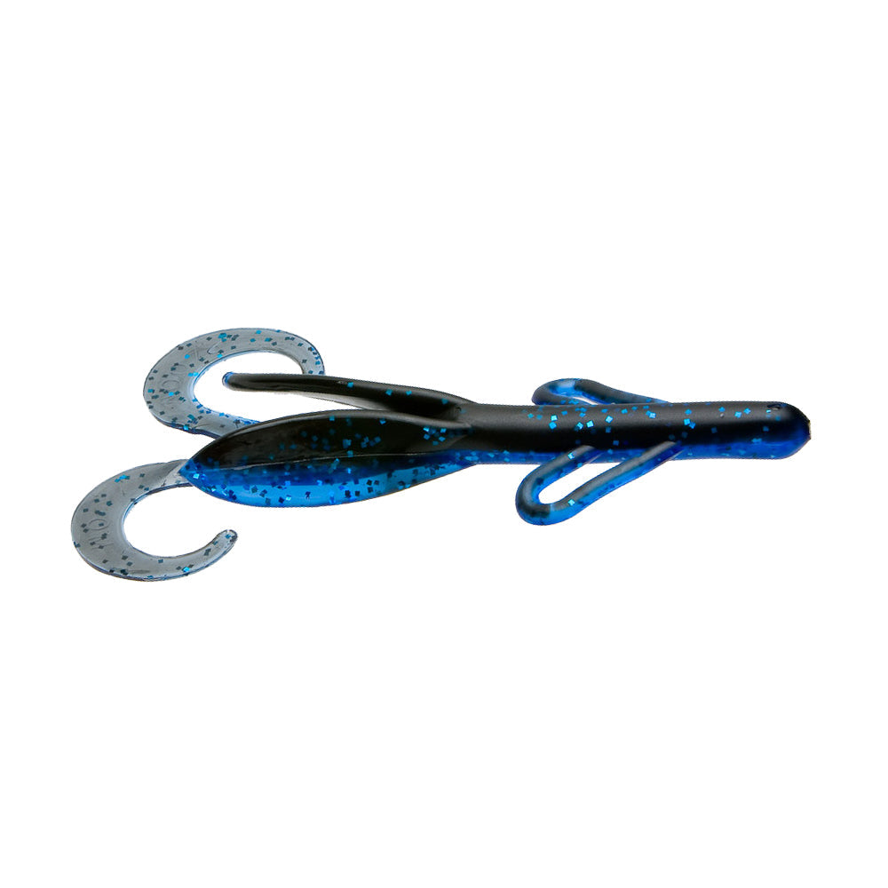 Zoom Brush Hog soft plastic fishing lure in black and blue with glitter, featuring twin curly tails designed for lifelike movement to attract fish.