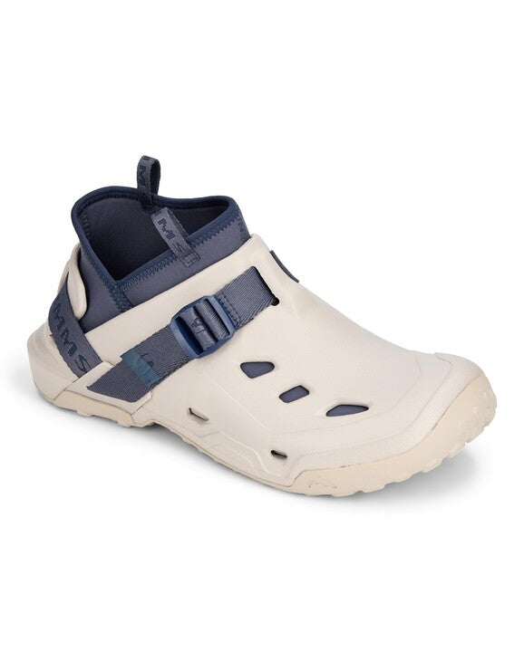 Simms Drifter AT slip-on fishing shoe in beige with navy blue adjustable strap and neoprene collar, designed for comfort and durability in wet environments.
