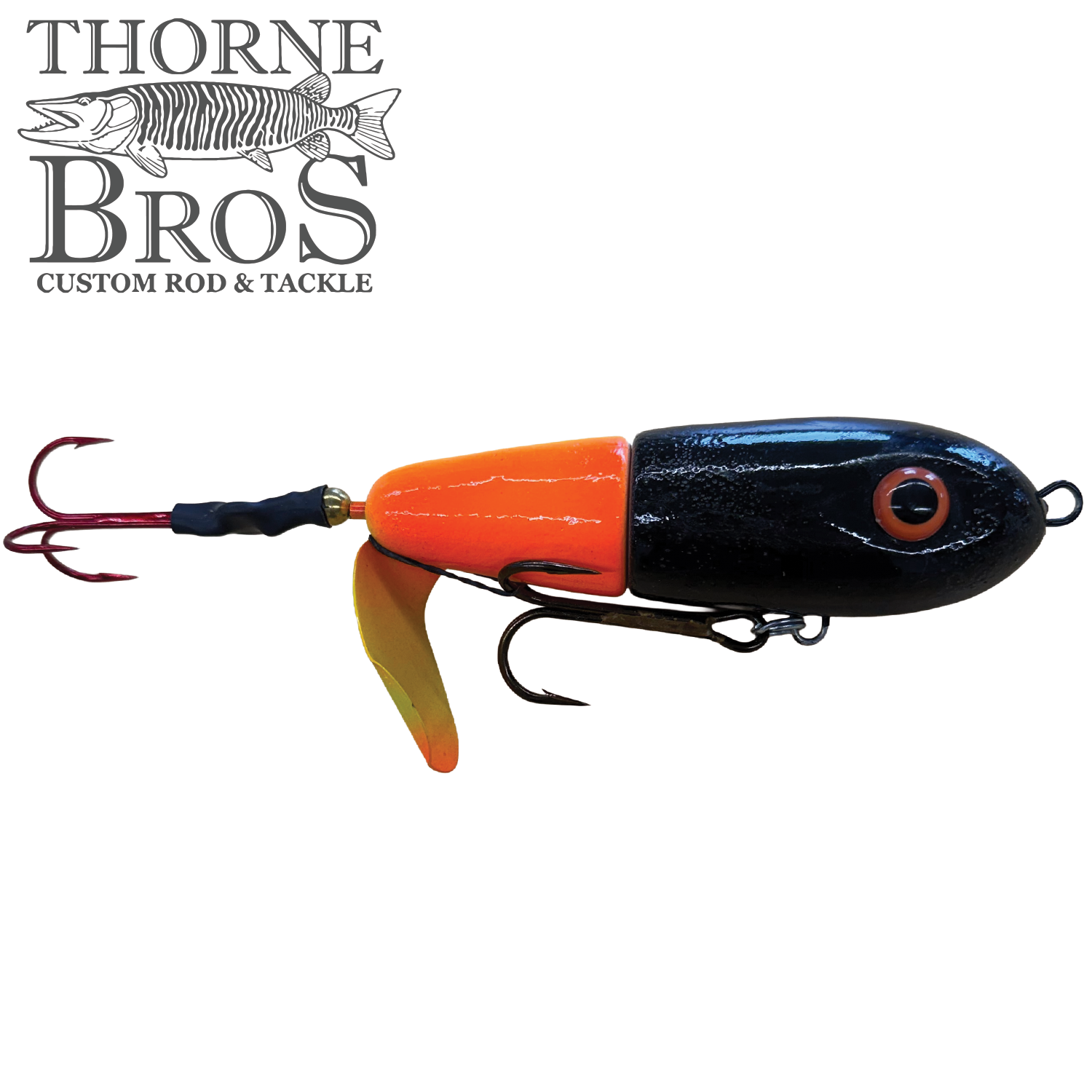 Lake-X Dr. Evil fishing lure in bright orange and black with dual treble hooks and a yellow propeller, designed for musky fishing by Thorne Bros.