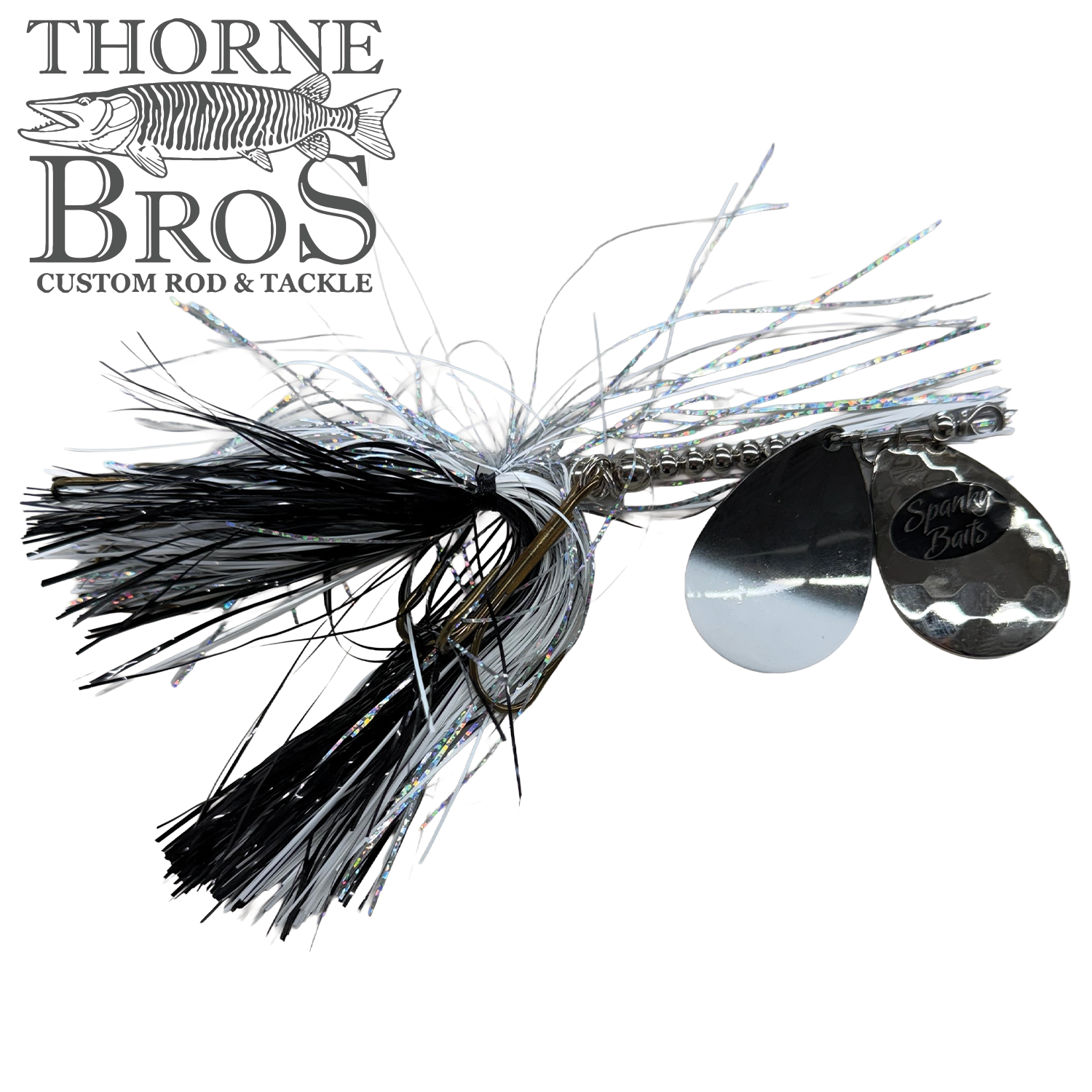 Spanky Baits Fireball 8" fishing lure with black and silver skirt, two shiny silver spinner blades, and reflective fibers designed for musky fishing.