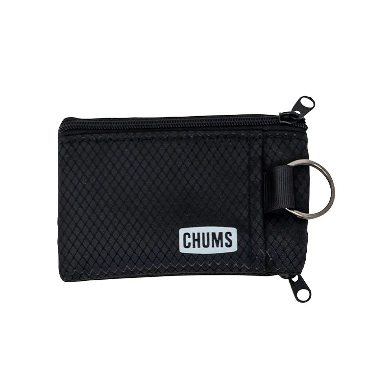 Chums Surfshorts Wallet in black with a textured fabric exterior, dual zipper compartments, and a metal key ring for secure storage and easy access.