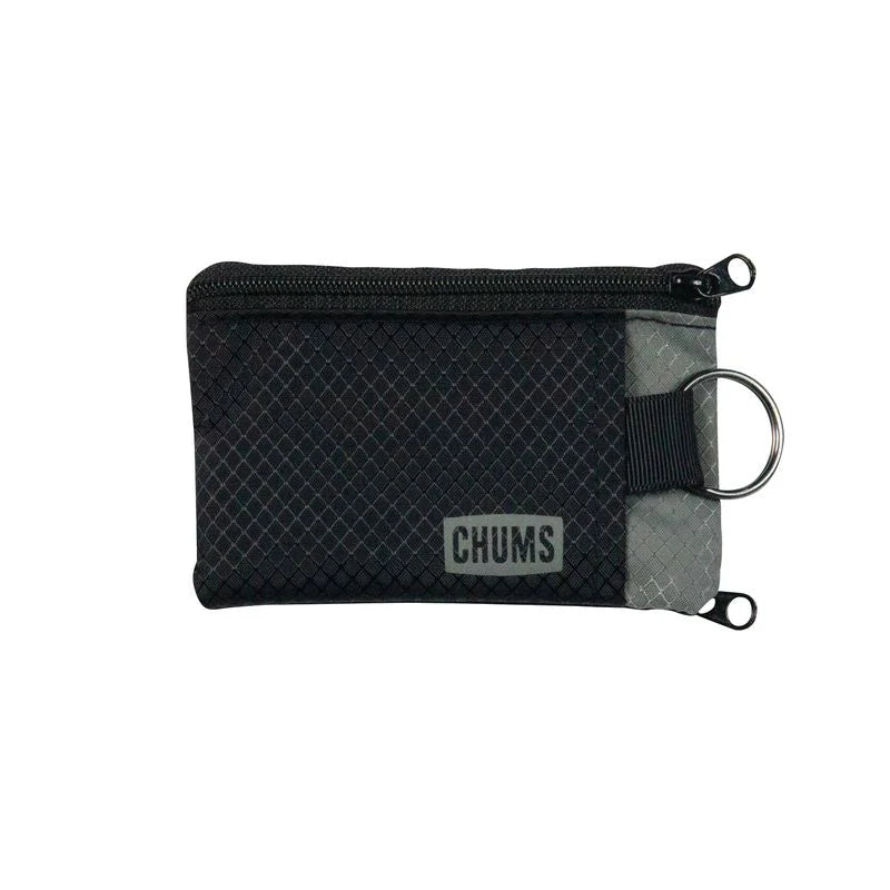 Chums Surfshorts Wallet in black and gray, compact zippered pouch with keyring attachment, designed for secure storage of small essentials during fishing or outdoor activities.