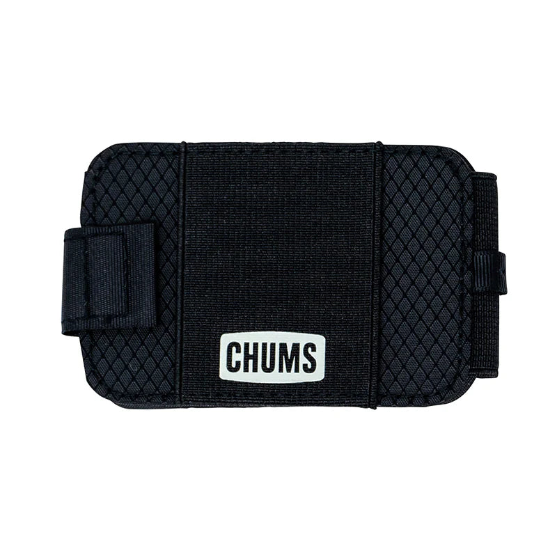 Chums Bandit Bi-Fold Wallet in black with textured exterior and elastic band closure featuring a white logo patch, designed for secure and compact storage.