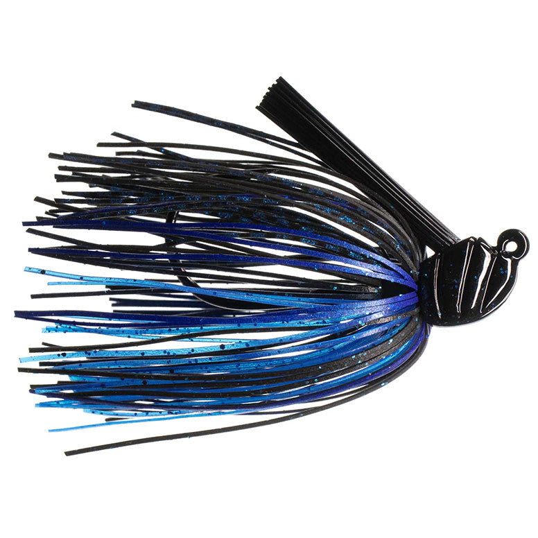 Dirty Jigs Scott Canterbury Flippin Jig with black and blue silicone skirt and weighted head, designed for fishing tackle targeting musky and other freshwater species.
