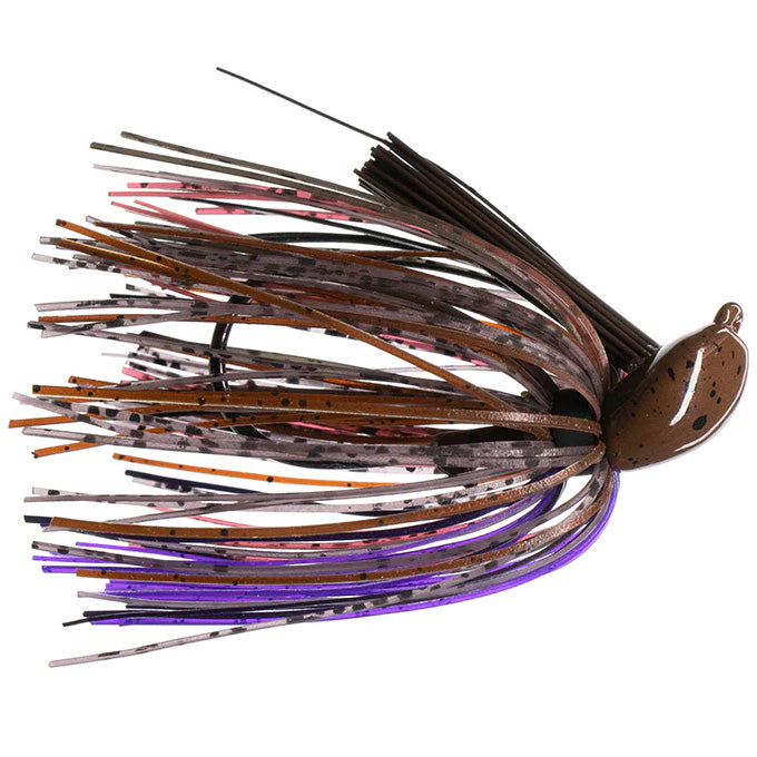 Dirty Jigs Tour Level Pitchin' Jig showing a detailed close-up of a multi-colored skirted fishing lure with brown, purple, and black hues designed for musky fishing tackle.