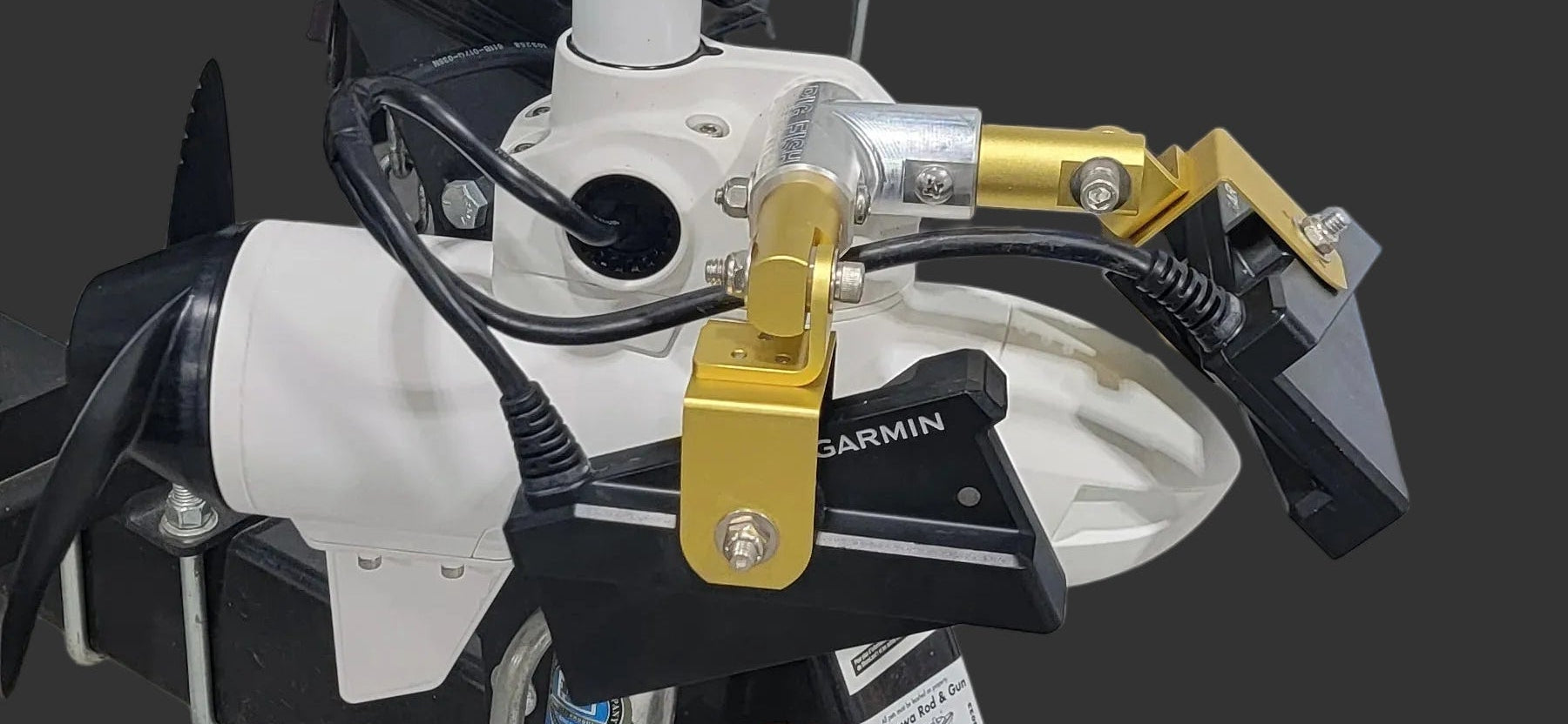 Big Fish Encounters Garmin Kraken Dual Livescope Adjustable Bracket (SKU: Duallvs34) mounted on a fishing motor with visible cables and gold-colored adjustable arms, designed for marine electronics use.