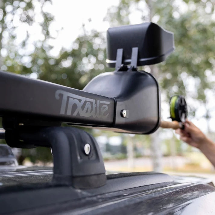 Trxstle CRC Flr Rod Carrier V3.0 black roof mounted fishing rod carrier shown secured to a vehicle for outdoor fishing gear transport