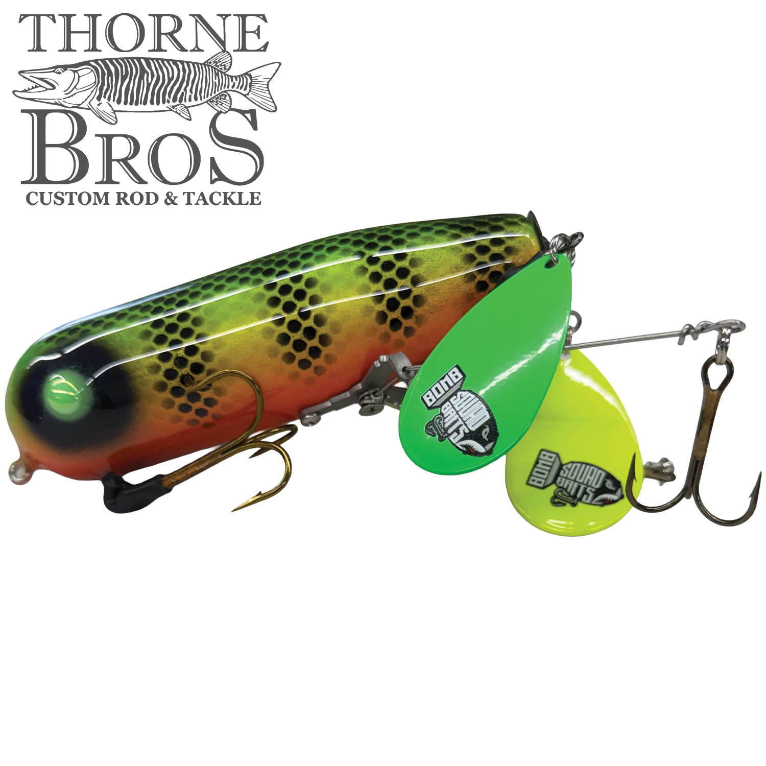 Bomb Squad Double Tap Flap Tail fishing lure with vibrant green, yellow, and orange patterned body, equipped with dual treble hooks and two colorful spinning blades for effective tackle use.