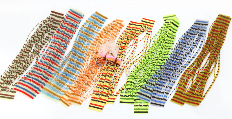 Hareline Triple Barred Heavy Duty Silicone Legs in various colors including brown, red, orange, yellow, green, blue, and yellow-orange, displayed for fishing lure customization.