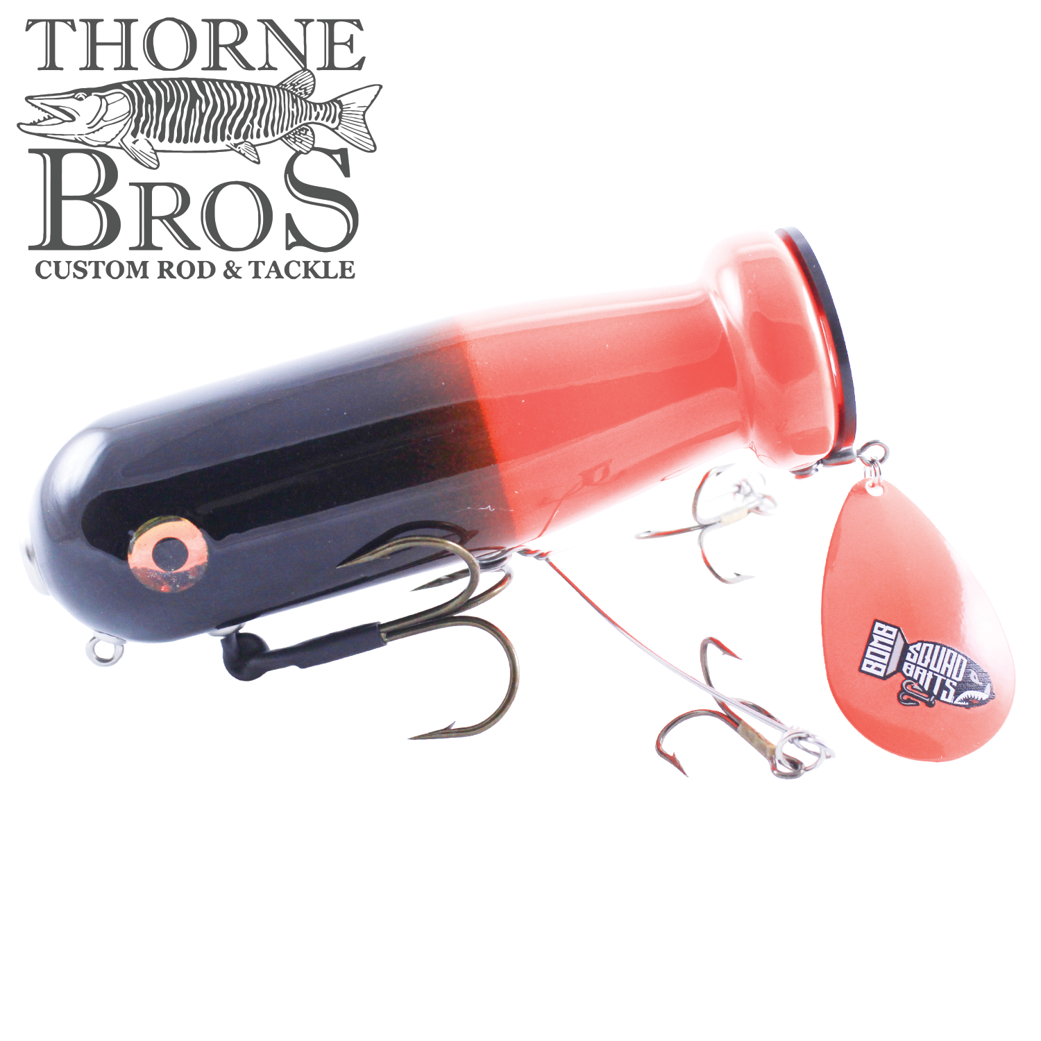Bomb Squad MK-65 Flap Tail fishing lure in black and red with multiple hooks and a red spinning tail blade featuring a logo, designed for musky fishing.