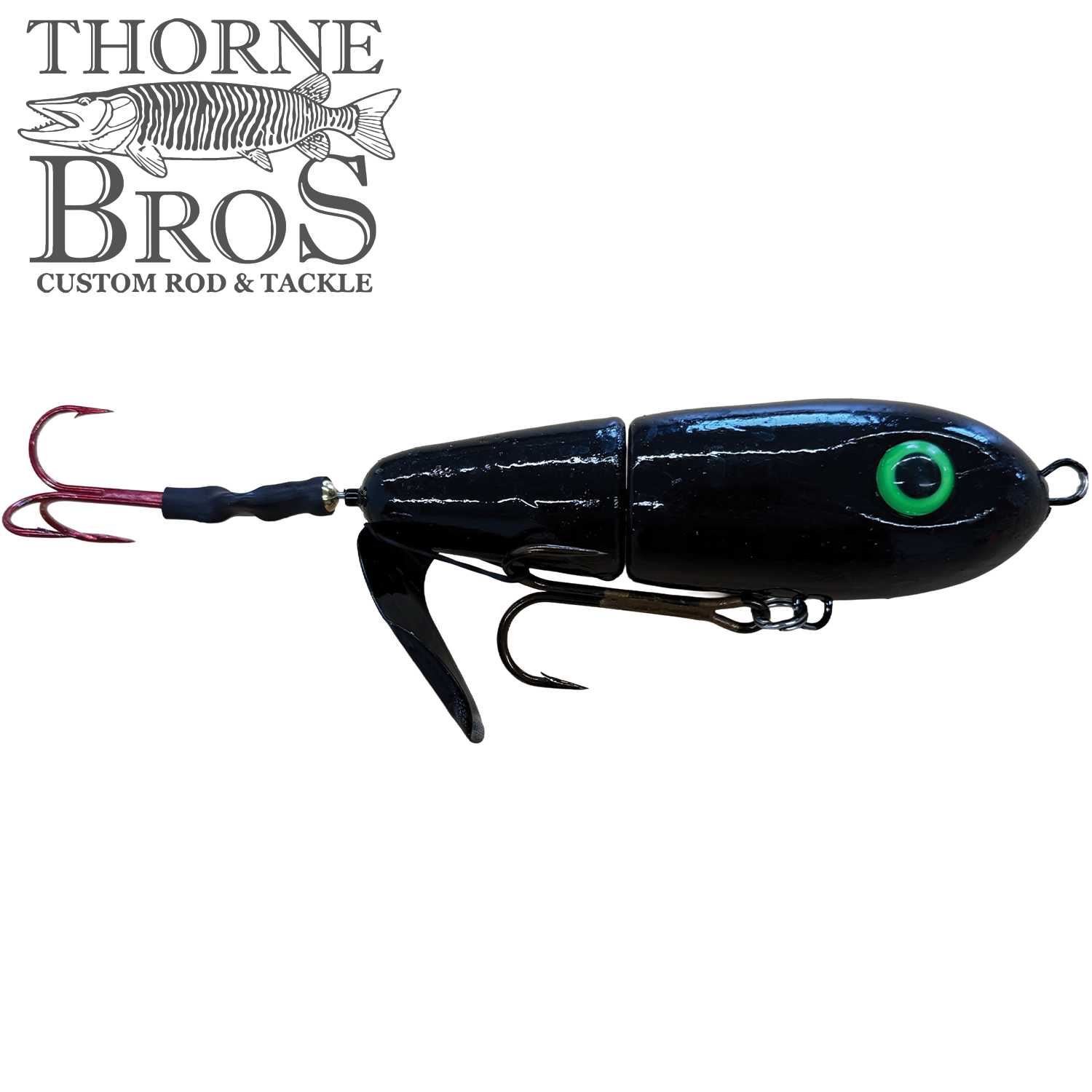 Lake-X Dr. Evil fishing lure in black with green eye detailing, featuring a jointed body and multiple treble hooks, designed for musky fishing and included in Thorne Bros fishing tackle.