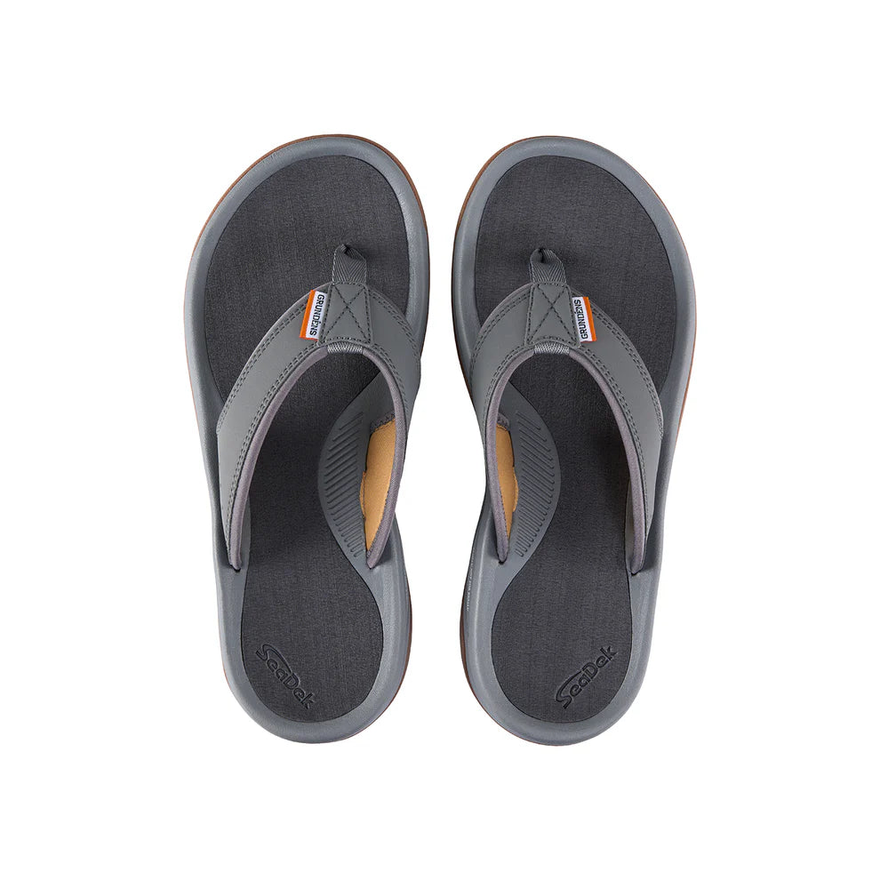 Pair of gray and black Grundens Deck Boss Sandals designed for comfort and durability, featuring cushioned footbeds and sturdy straps suitable for outdoor and fishing activities.