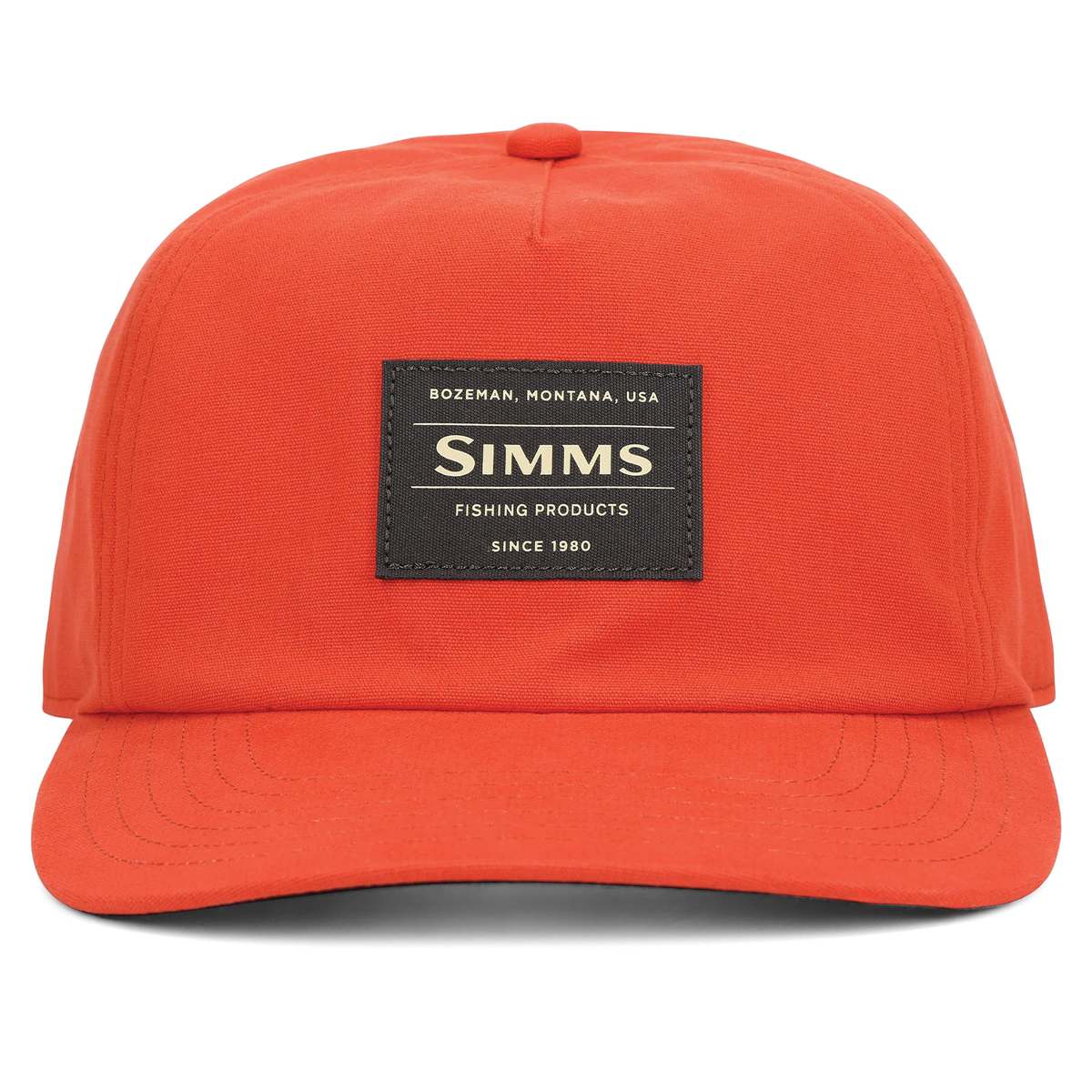 Simms Double Haul Cap in bright orange with a curved brim and stitched front logo patch shown against a white background