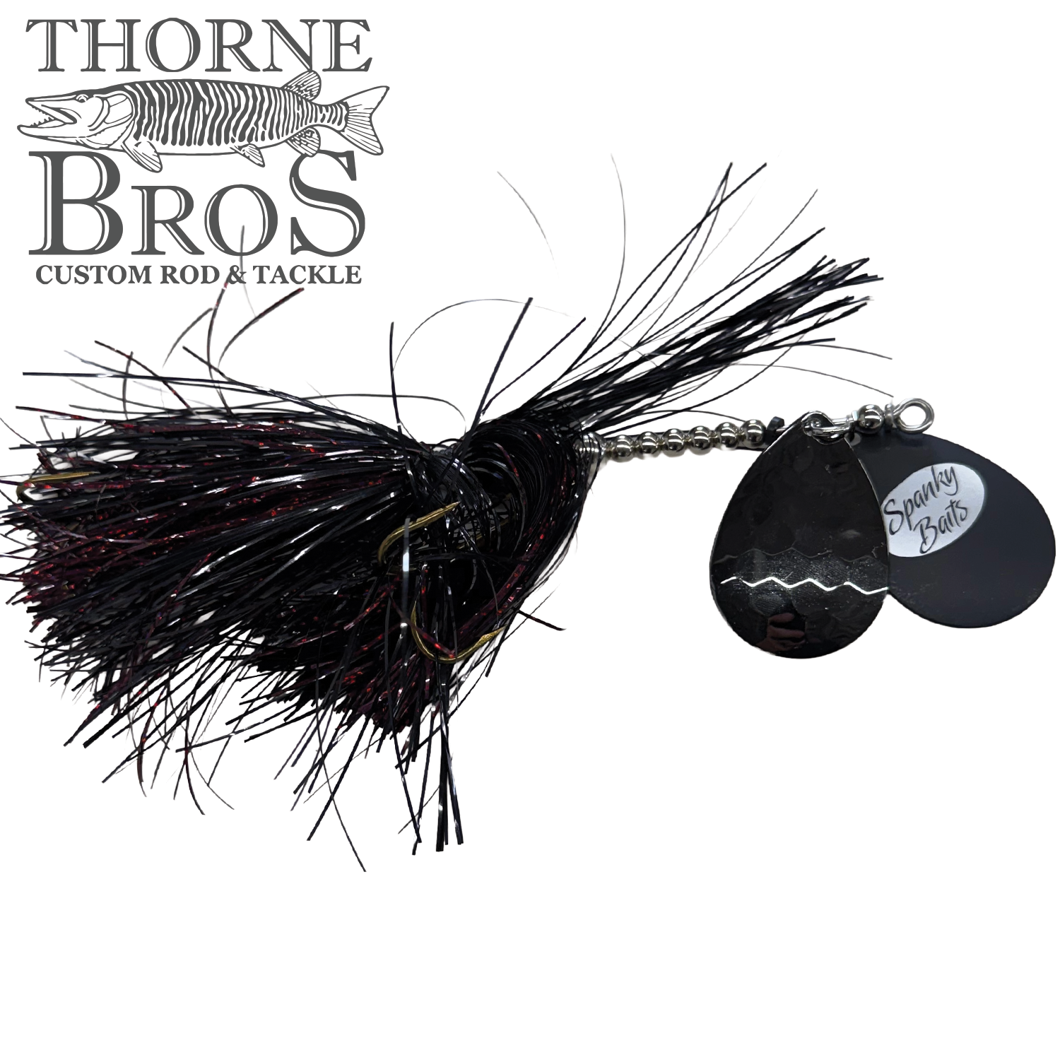 Spanky Baits Fireball 8" fishing lure featuring black and red synthetic fibers with dual black metal spinner blades, designed for musky fishing tackle and effective water movement.