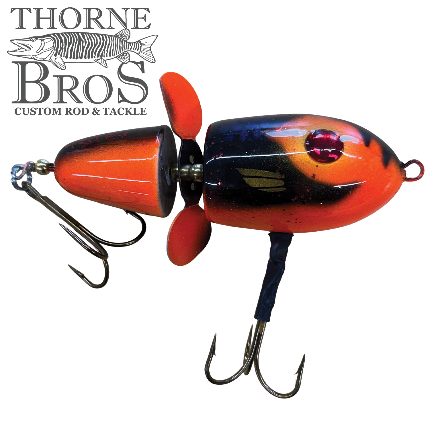 Lake-X Hammer musky fishing lure in vibrant orange and black with two treble hooks and a propeller, designed for effective fishing tackle performance.