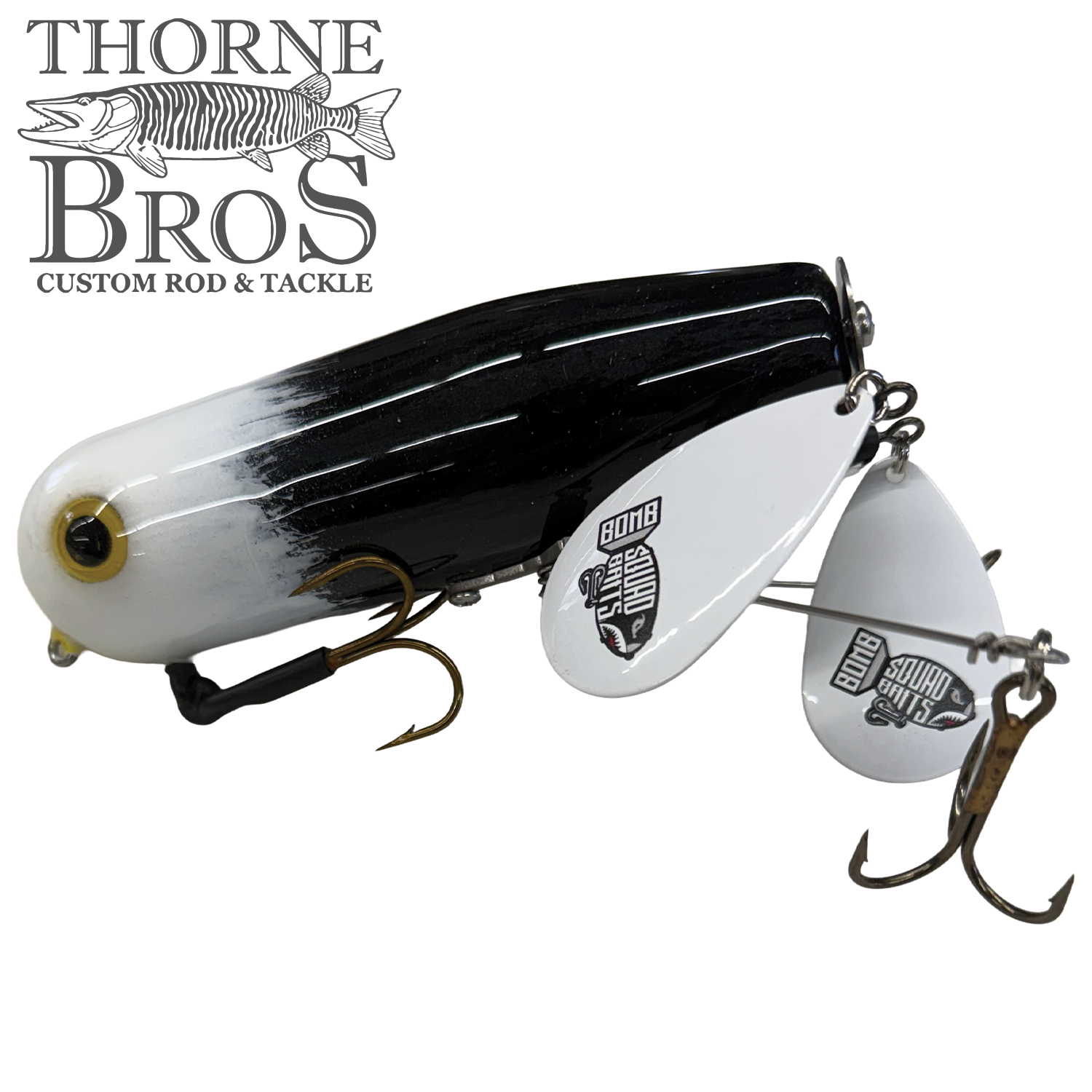 Bomb Squad Double Tap Flap Tail fishing lure in black and white with dual metallic white flap tails and treble hooks, designed for musky fishing by Thorne Bros.