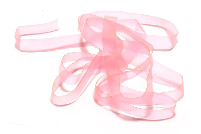A close-up of the translucent pink Hareline Scud Back fly tying material used for creating fishing lures in fly fishing and fishing tackle.