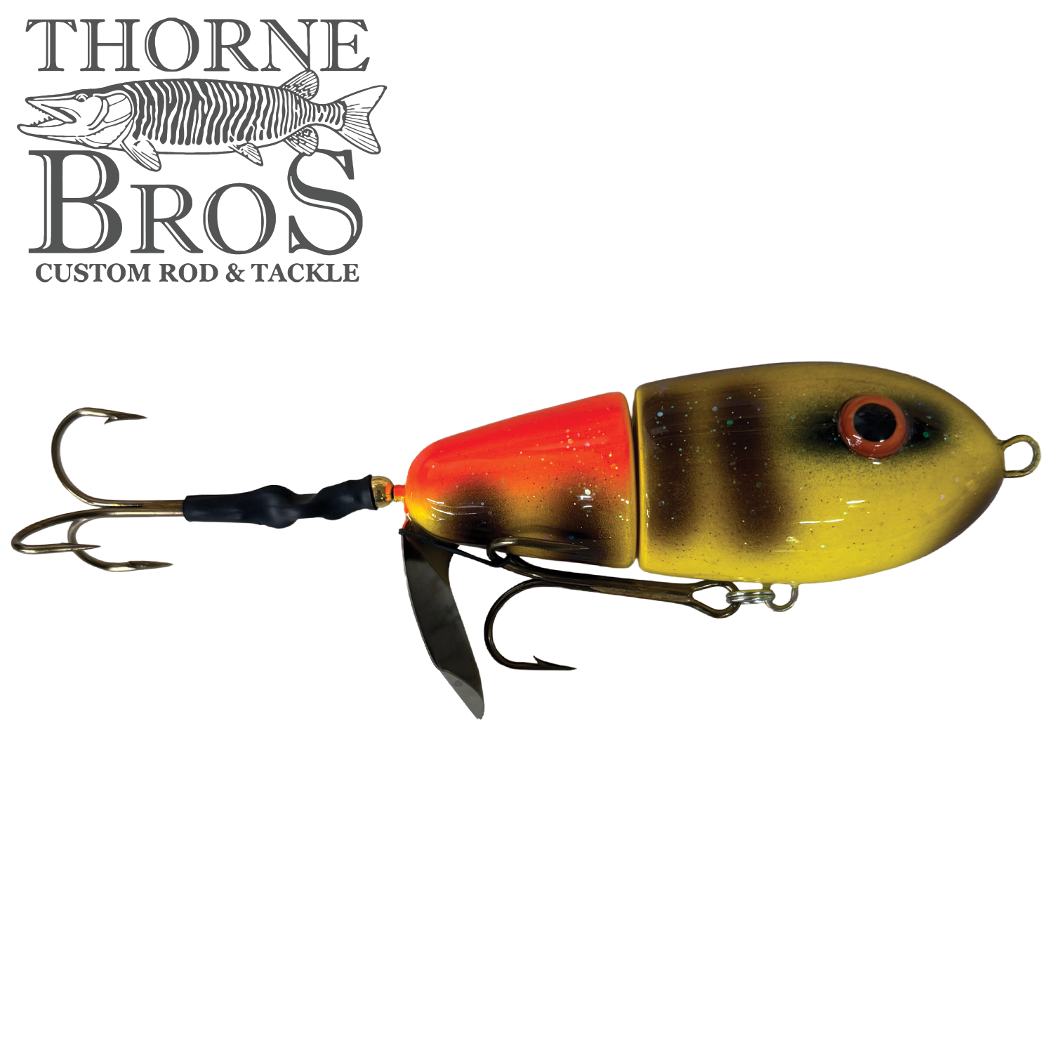 Lake-X Fat Bastard fishing lure in segmented design with yellow, brown, and red coloring, featuring multiple treble hooks and a metal spinner blade for musky fishing.