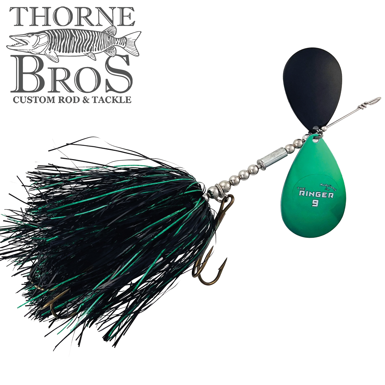 Detailed close-up of the Musky Frenzy The Ringer 9 fishing lure featuring a black and green skirt, a black and green spinner blade, and a sharp treble hook designed for musky fishing.