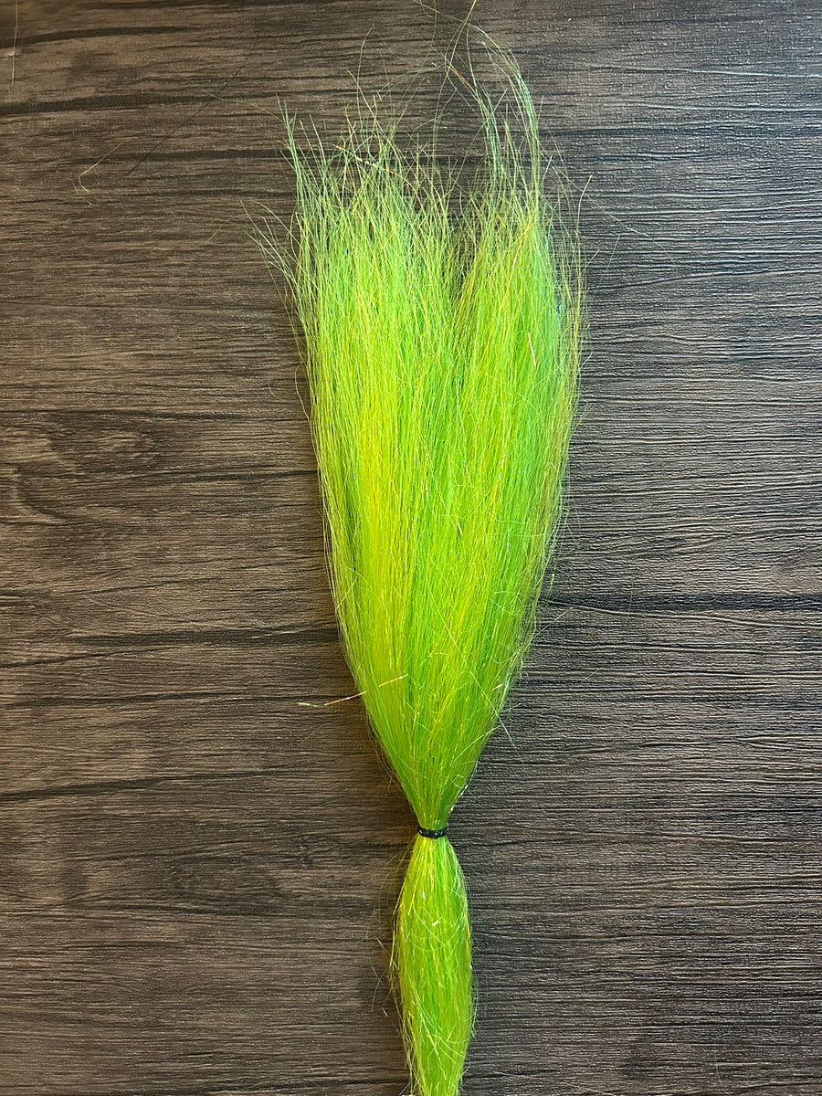 Bright chartreuse fiber bundle with a subtle sparkle effect, designed for fly fishing and musky tackle, labeled as Squimpish Sparkle Blend on a wooden surface.