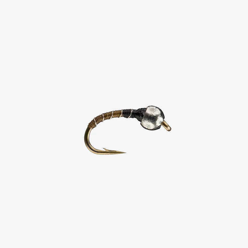 Close-up of a Zebra Midge Tungsten fishing lure featuring a gold hook, black and brown thread body, and a shiny tungsten bead head designed for freshwater fly fishing tackle.