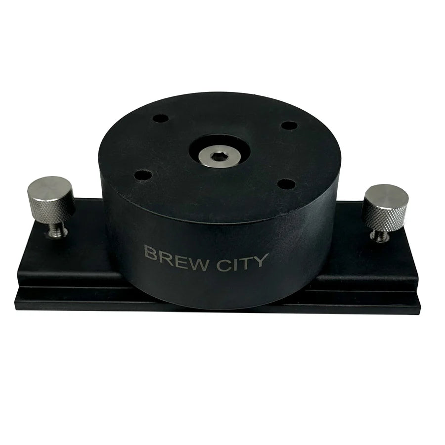Black Brew City LOX360 Shuttle Mount with a circular central body and two silver adjustable knobs on a rectangular base, designed for secure fishing rod attachment.
