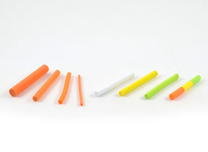 A set of colorful cylindrical foam pieces in various sizes and colors including orange, white, yellow, and green, arranged in a row, representing Rainy's Parachute Posts fishing tackle accessory.