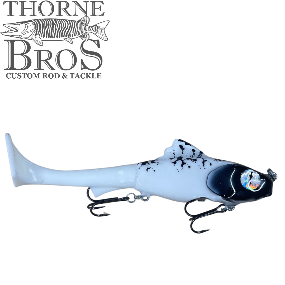 Zilla Baits Junior Hooker fishing lure in white and black with two treble hooks, designed for musky fishing, displayed against a white background with Thorne Bros logo.