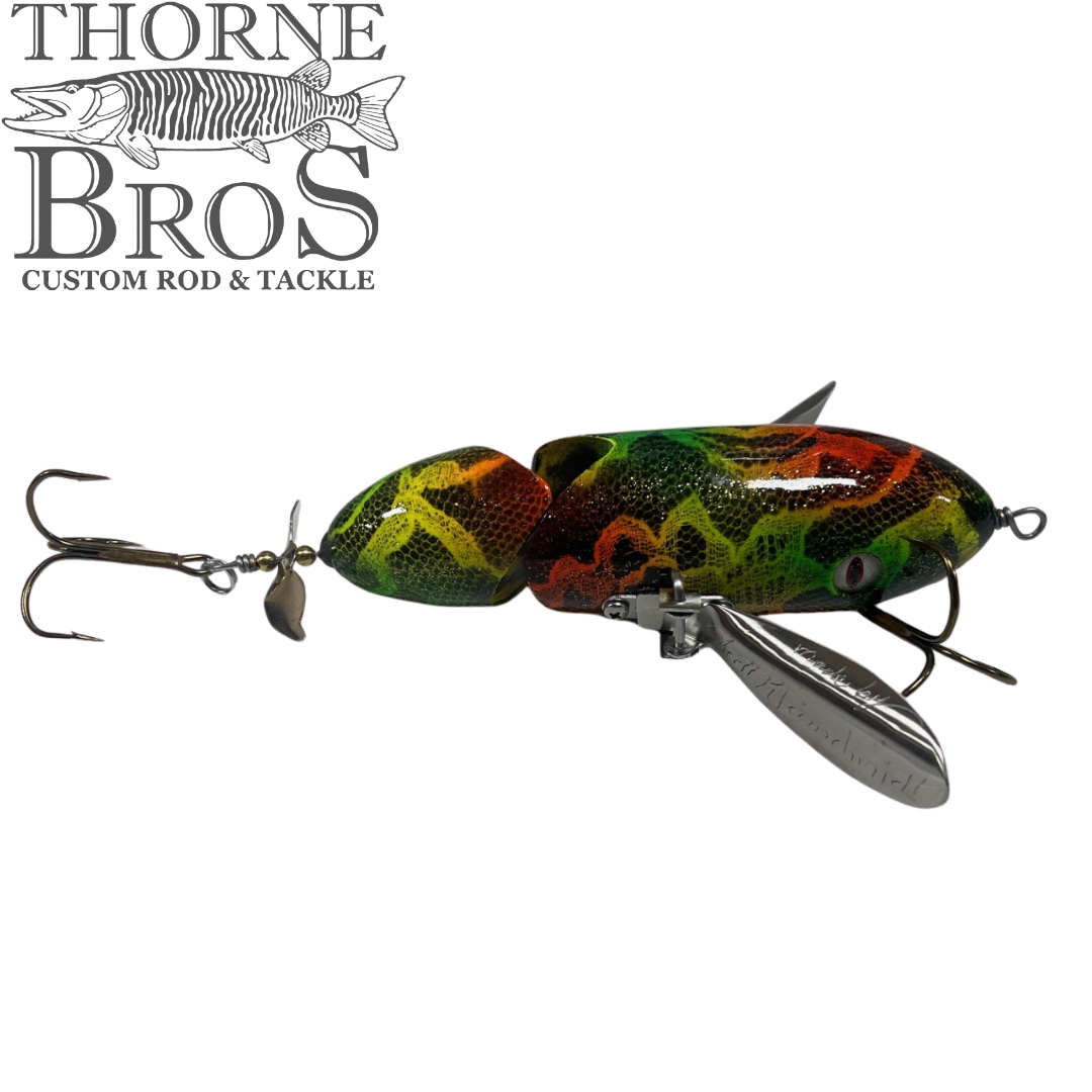 Simulated alt text for Musky Safari Jointed Spitzer for thorne-bros-custom-rod-tackle.myshopify.com. You are an expert SEO agent. You will generate an ALT text for this image. <Store_Context> Business Details: - Premier Midwest shop specializing in musky tackle...