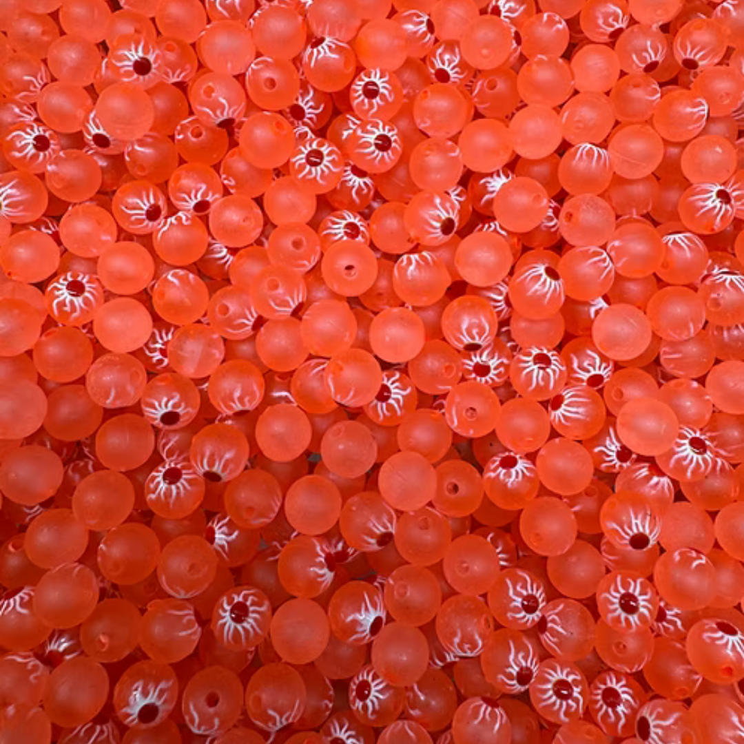 Bloop Bead Co. orange fishing beads with white striped markings displayed in a pile for fishing tackle and lure making