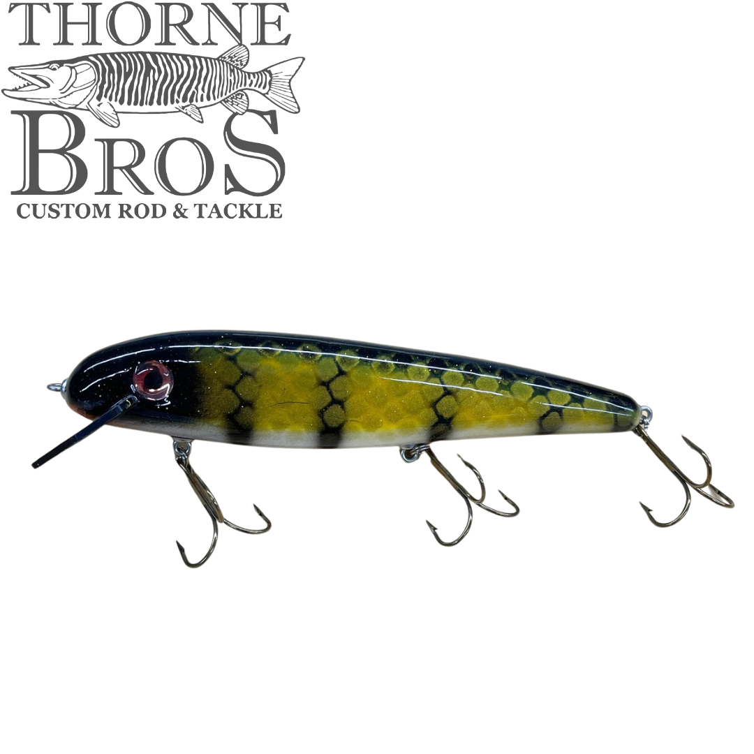 Thorne Bros Phantom Hex 10" musky fishing lure with black olive and yellow scale pattern diving lip and three treble hooks on white background