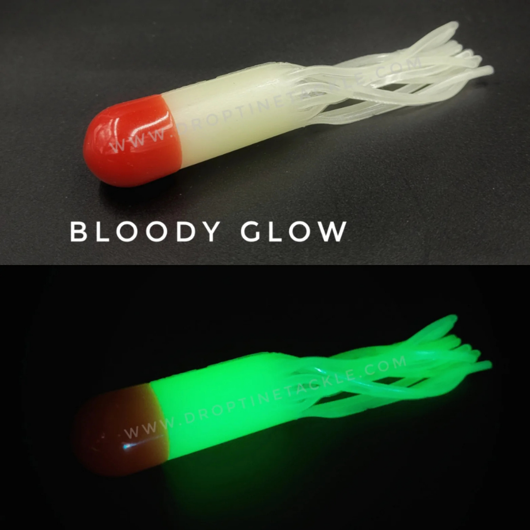 Drop Tine 4" Trout Tube - Fatty fishing lure in Bloody Glow color, showing bright white and red soft body with flexible tentacle-like appendages glowing green in the dark.