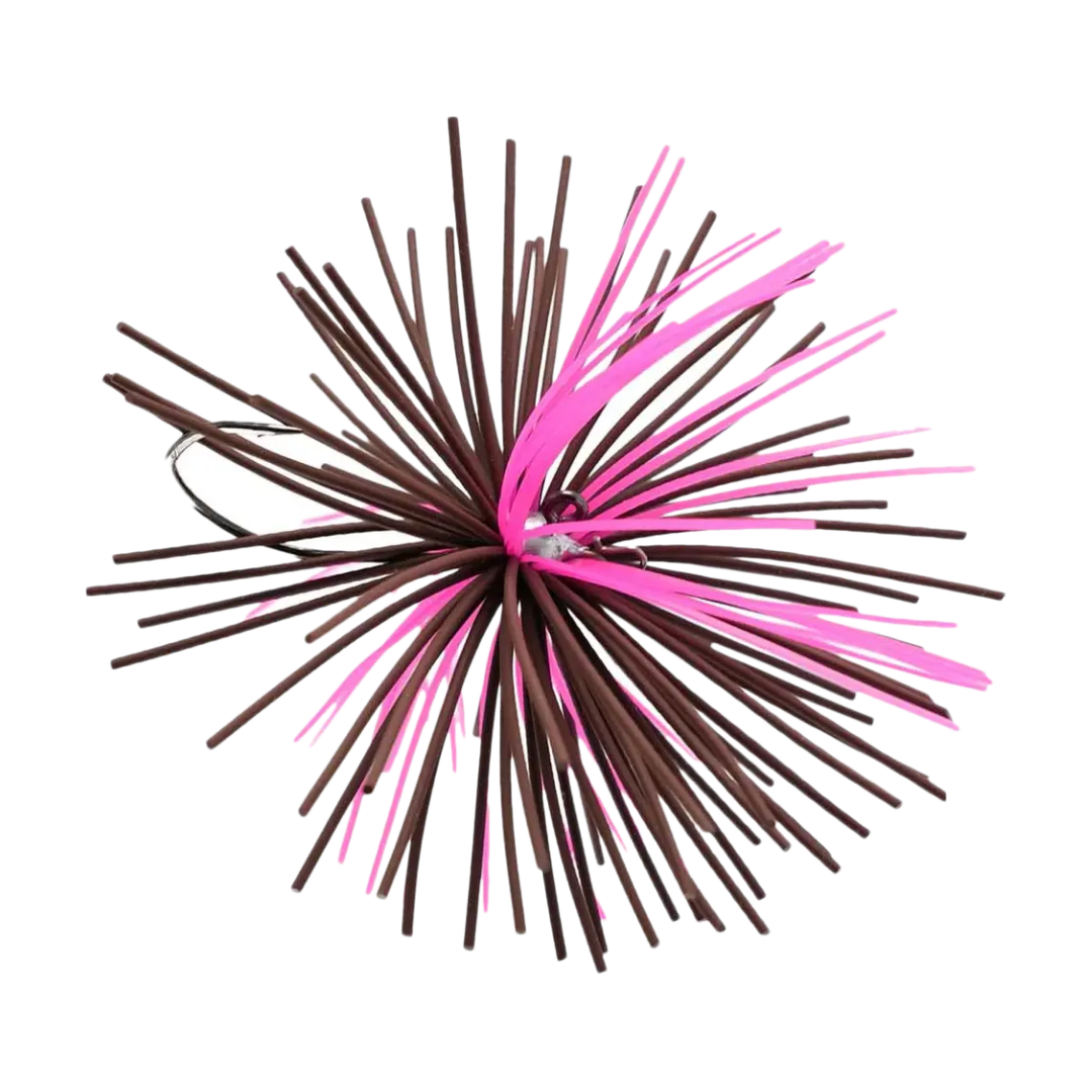Close-up of a Missile Baits Dice Jig fishing lure featuring brown and pink rubber skirt strands with a visible hook, used for fishing tackle.