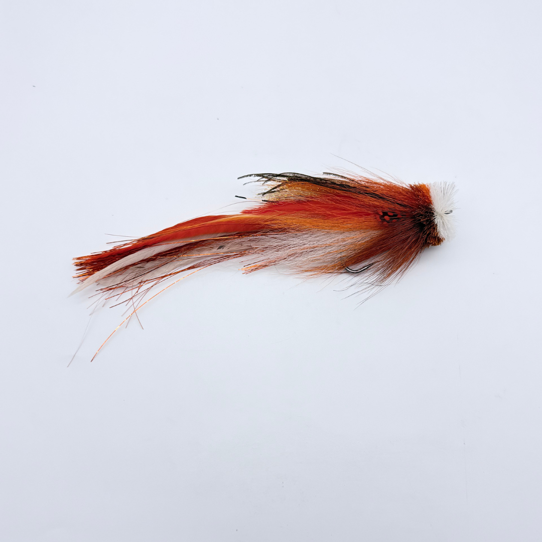 Single Buford Urban Fly Co. fishing lure featuring a detailed design with long, flowing red, orange, brown, and white feathers for fly fishing.