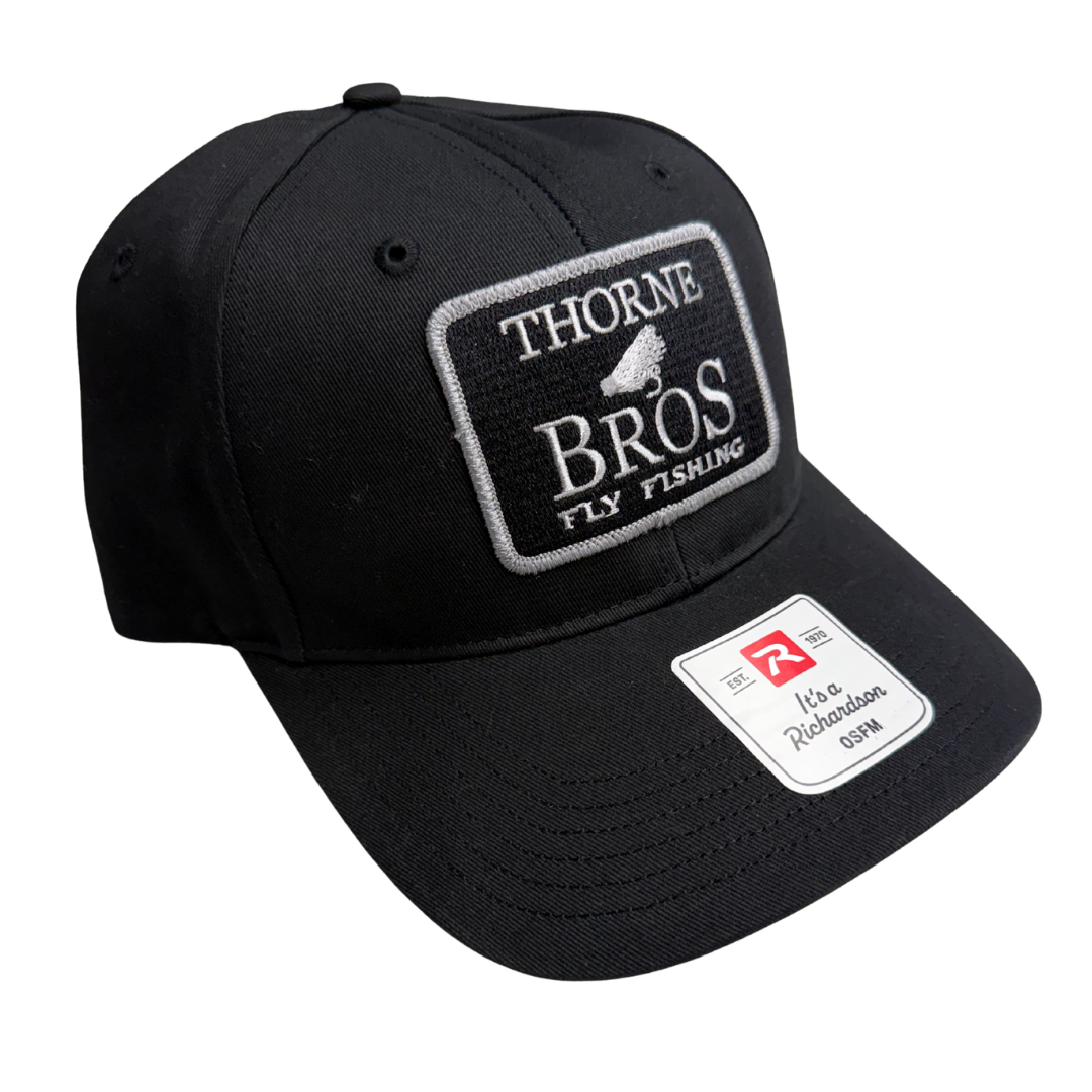 Thorne Bros Fly Fishing Logo Richardson R75S Black cap with embroidered Thorne Bros Fly Fishing patch and curved bill