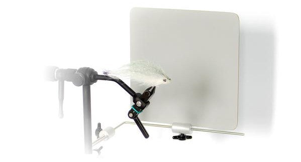 Renzetti Visual Enhancement Plate showing a mounted fishing fly in a vise with a neutral backdrop for clear visibility, used for detailed fly tying and fishing tackle preparation.