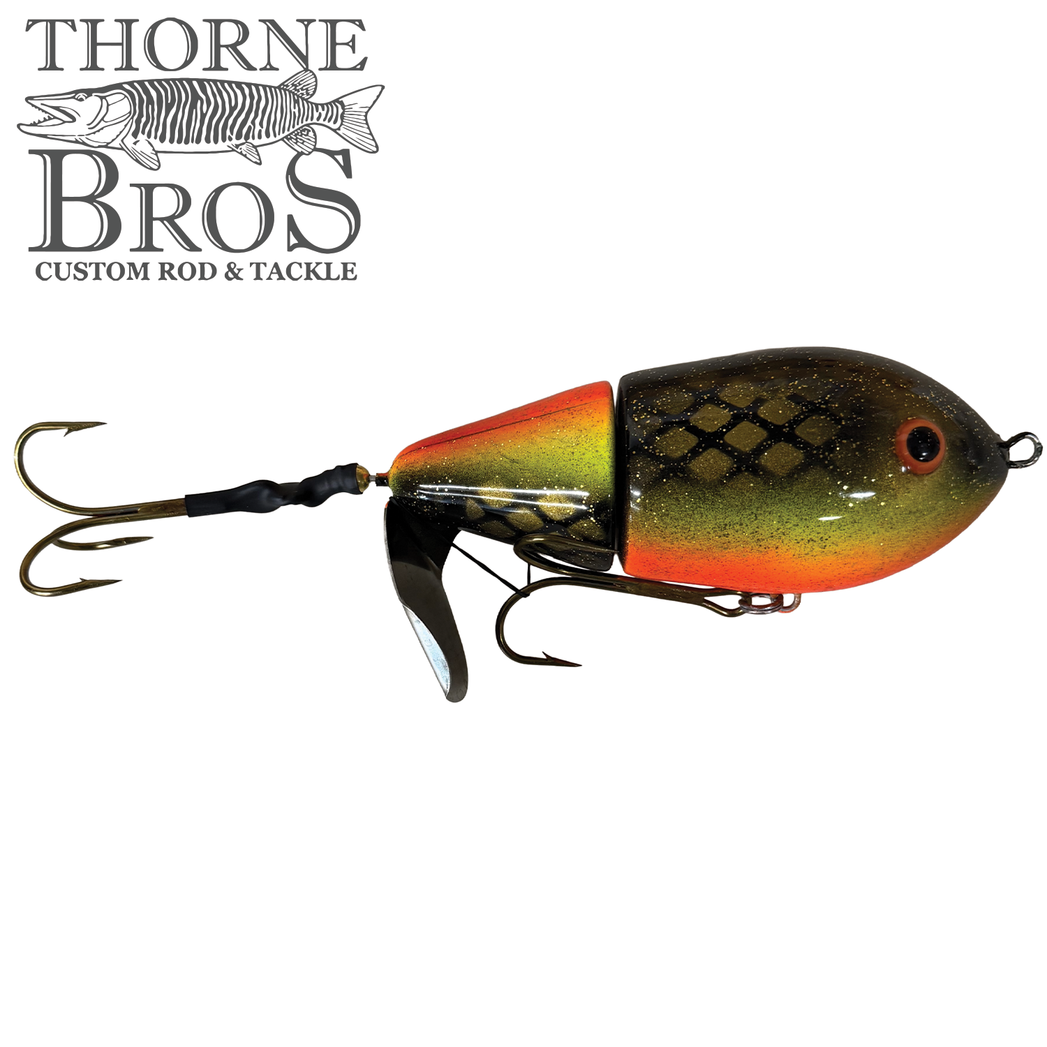 Lake-X Cannonball JR. fishing lure with a segmented body in green, orange, and black hues, featuring treble hooks and a metal spinner blade for enhanced water action.