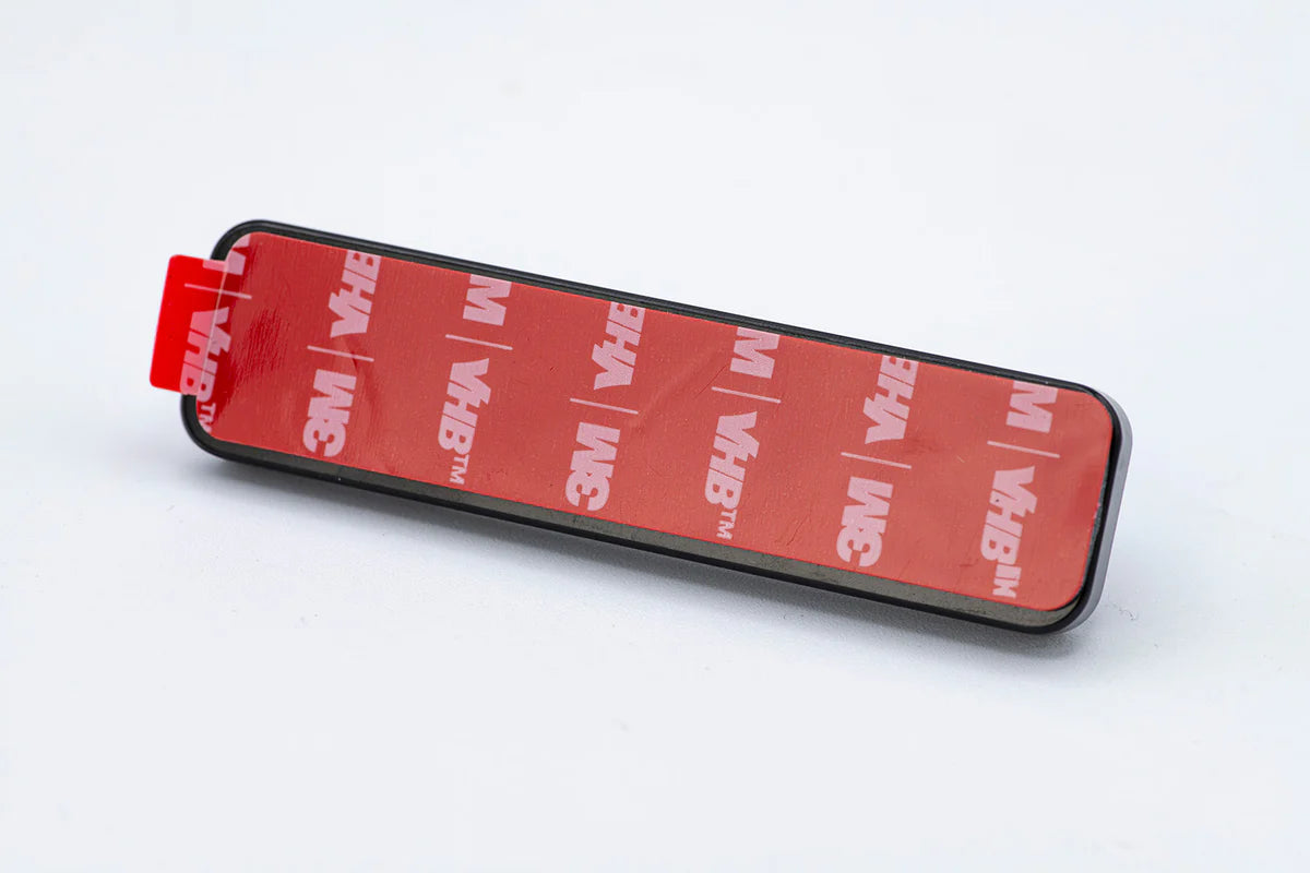 Cling Tool Stick Mini with a rectangular adhesive backing featuring red 3M VHB tape, designed for secure attachment of fishing tackle tools and accessories.