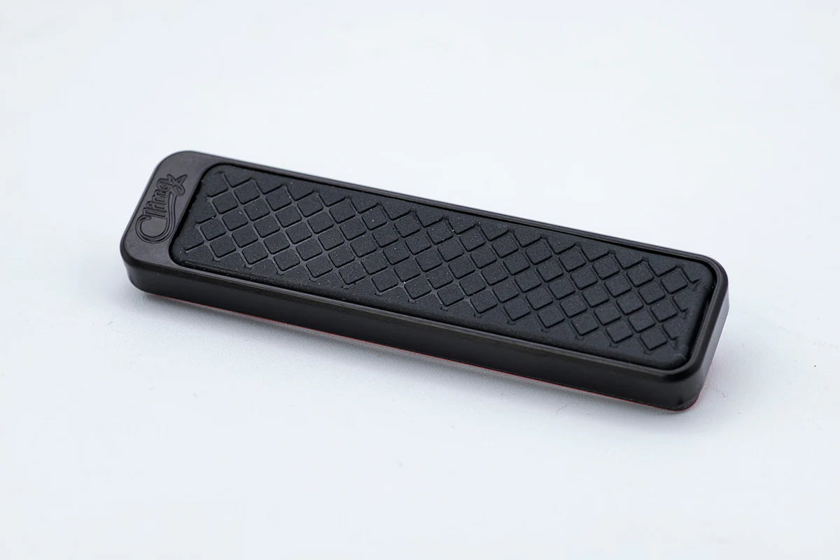 Cling Tool Stick Mini in black with textured grip surface, designed for securely holding fishing tackle and accessories.