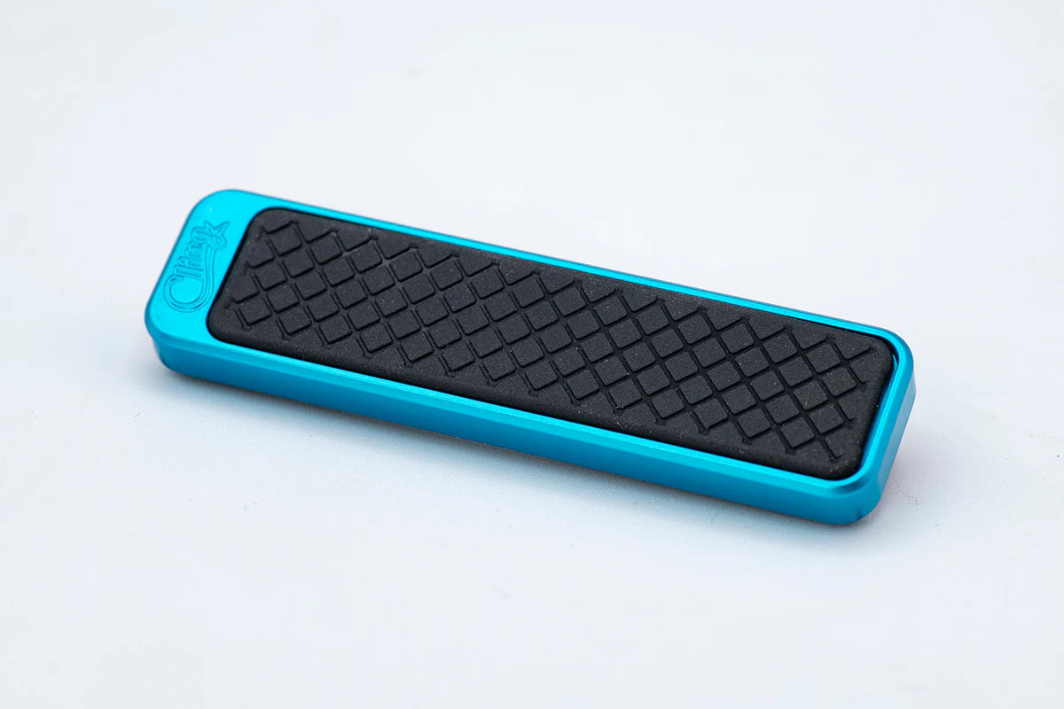Cling Tool Stick Mini in blue with a textured black rubber grip, designed for securely holding fishing tackle during musky and ice fishing activities.