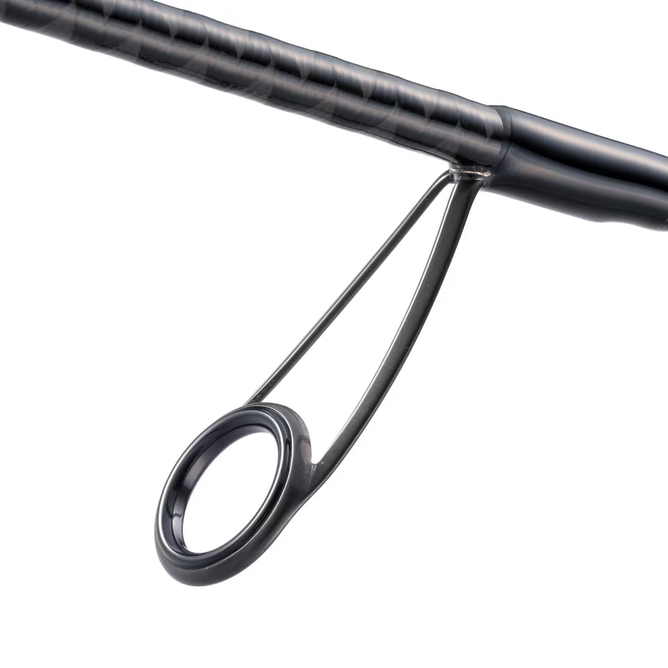 Close-up view of the black fishing rod guide and handle section of the Shimano Zodias B - Spinning rod, showcasing its sleek design and durable construction for fishing tackle.
