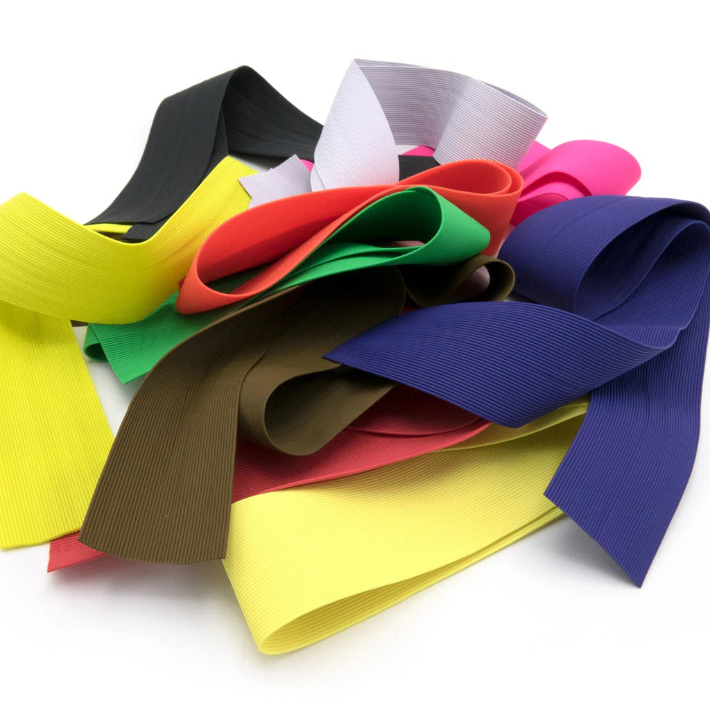 Wapsi Round Rubber Legs Medium in various bright colors including yellow, green, red, purple, brown, black, and pink, displayed on a white background.