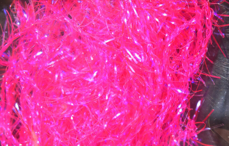 Bright pink synthetic fibers with reflective strands designed for fly fishing lure tying, shown as Hareline Polar Chenille - Micro material.