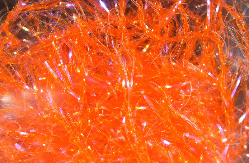 Close-up view of bright orange Hareline Polar Chenille - Micro fishing lure material with shiny, fibrous texture used for crafting fishing tackle and custom rods.