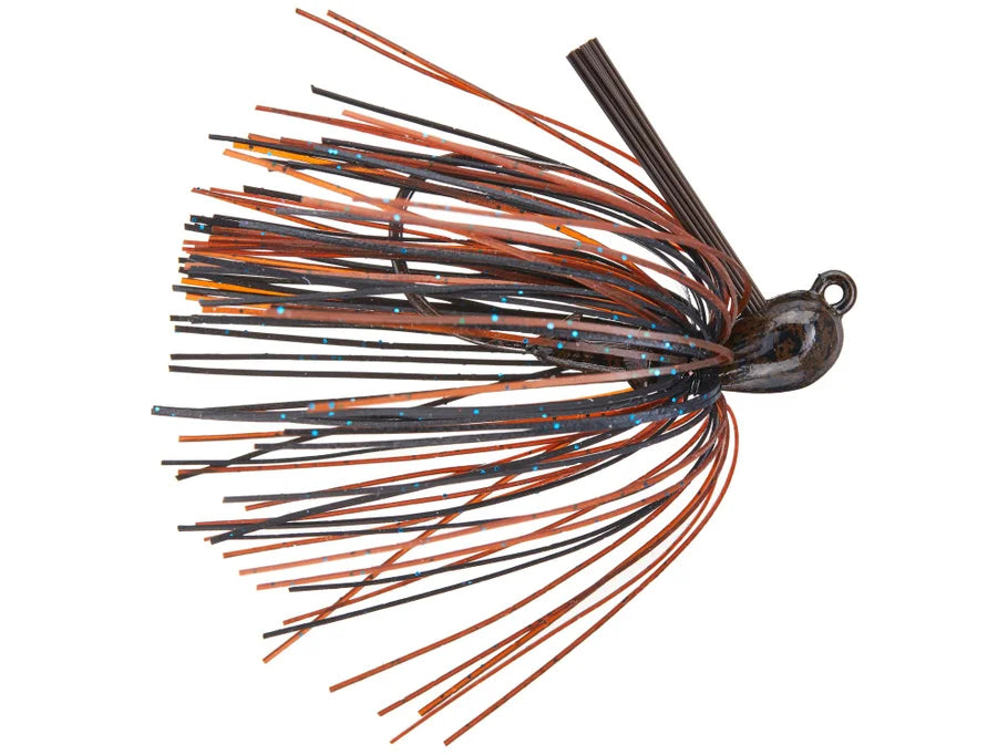 Greenfish Cobb's All Purpose Jig fishing lure in black and orange with blue speckles, featuring a weighted head and flexible skirt strands for versatile fishing tackle use.