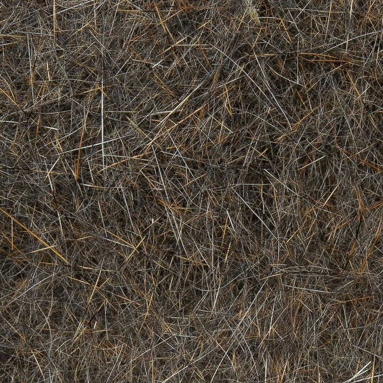 Close-up of natural fur fibers in shades of brown and gray used for Wapsi Natural Fur Dubbing, a material for tying fishing lures and fly fishing tackle.