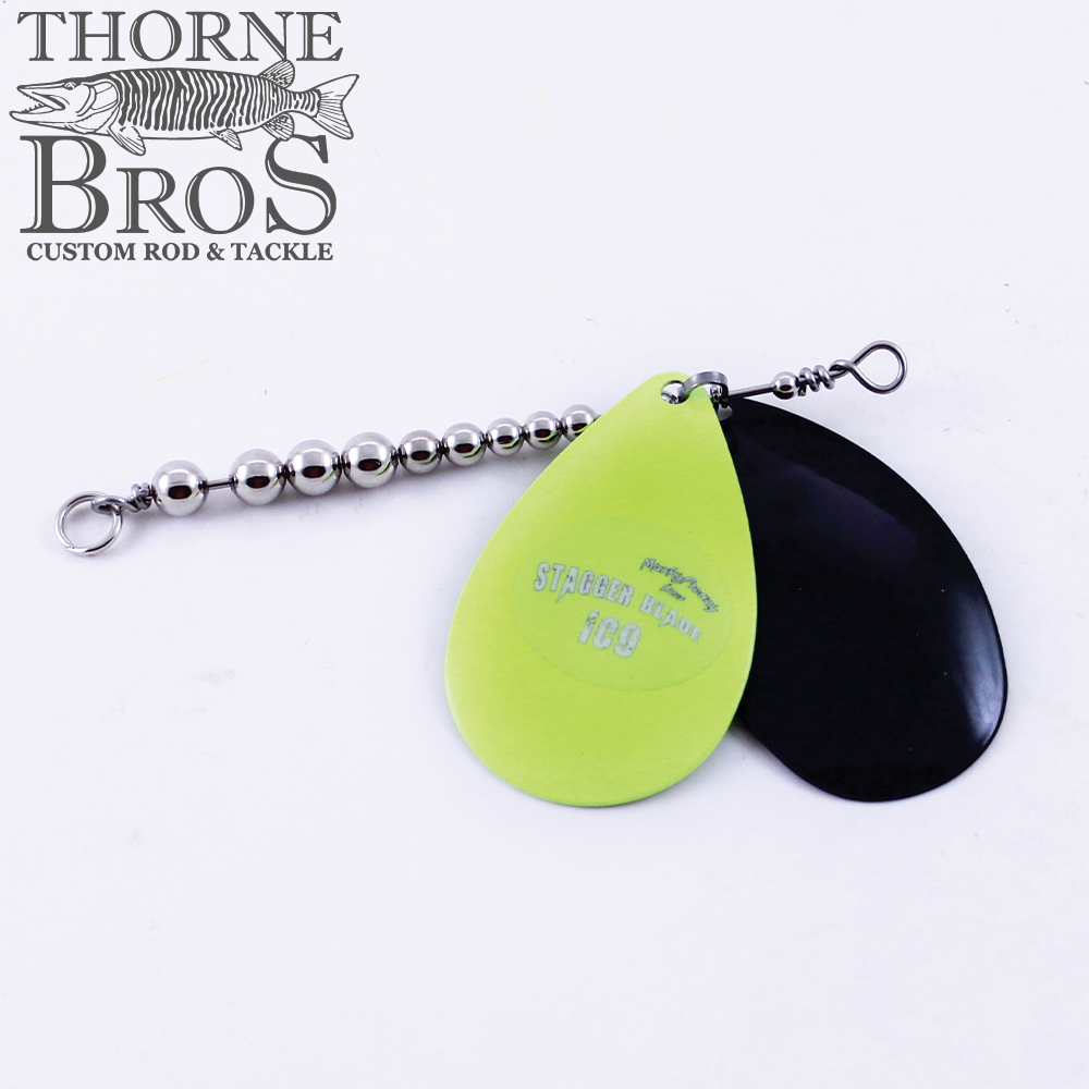 Musky Frenzy Blade Attachments featuring two curved metal blades, one lime green with text and one black, connected to a silver beaded swivel chain for fishing lure customization.