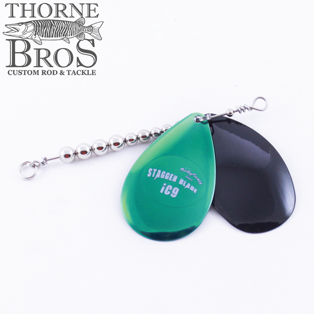 Musky Frenzy Blade Attachments featuring one chrome green and one black curved fishing blade connected to a beaded metal wire for enhanced fishing lure action.